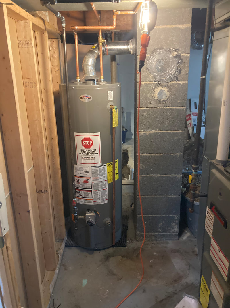 Newly installed Richmond water heater with clean copper and gas connections